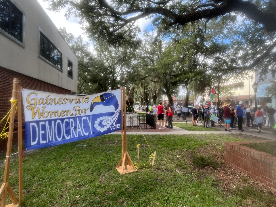 Badass Feminists and Women for Democracy hold Dual Protests on Labor Day at Depot Park and Downtown Gainesville